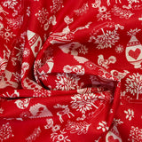 Popeline de coton imprimée pampille de Noël fond rouge