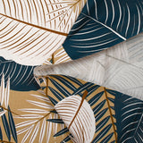 Popeline de coton imprimée grandes feuilles fond beige