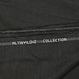 Fantasy wool blend suit fabric in mottled gray with black background