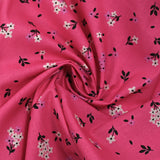 Popeline de coton imprimée fleurs printanières fond rose barbie