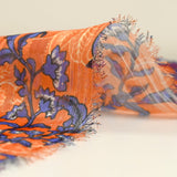 Mousseline imprimée bande satin violet fond orange