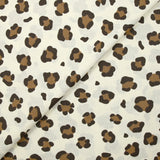 Coton imprimé léopard marron fond blanc cassé