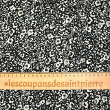 Mousseline imprimée bande satin fleurs fond noir