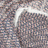 Mousseline imprimée bande satin oeil bleu fond vieux rose