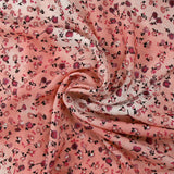 Voile de viscose imprimé fleurs dansantes fond rose brumeux
