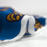 Viscose imprimée feuillage marine et curry fond bleu