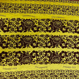 Cotton printed with giant brown flowers on anise green background