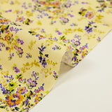 Popeline de coton imprimée fleur baroque mauve fond jaune pastel