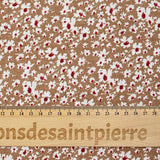 Viscose imprimée fleurs blanches et bordeaux fond noisette