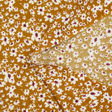 Viscose imprimée fleurs blanches et bordeaux fond ocre