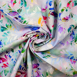 Popeline de coton imprimée floral abstrait multicolore fond mauve