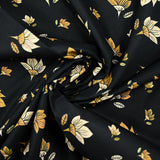 Popeline de coton imprimée fleur jaune pastel et miel fond noir