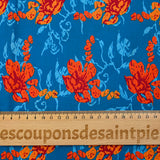 Popeline de coton imprimée fleur stylisée orange fond turquoise