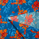 Popeline de coton imprimée fleur stylisée orange fond turquoise