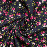 Popeline de coton imprimée mini fleur rose fond bleu minéral