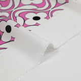 Viscose imprimée floral noir fond rose