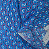 Coton imprimé vague fuchsia fond bleu