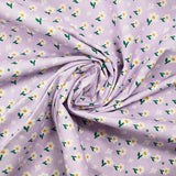 Popeline de coton imprimée marguerite blanche fond mauve