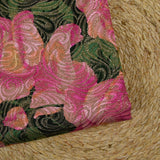 Gold brocade with pink flowers, green background