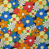 Coton imprimé floraison disco bleu roi, orange et jaune pâle