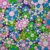 Coton imprimé flower power parme fond violet
