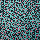 Coton imprimé léopard rose fond turquoise