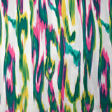 Crêpe viscose imprimé ondes abstraites turquoise et rose fond blanc