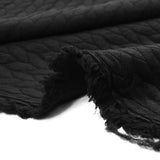 Matelassé jersey braids black background