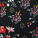 Popeline de coton imprimée archipel floral fond noir