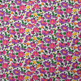 Popeline de coton imprimée brume de fleurs violet et rose fond blanc