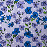 Popeline de coton imprimée fleurs grimpantes fond à pois mauve