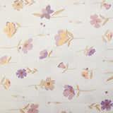 Popeline de coton imprimée fleurs pastel mauve et pêche fond blanc