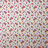 Popeline de coton imprimée un air de fleurs violet, jaune et framboise fond blanc