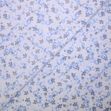 Popeline polycoton imprimée camouflage bleu