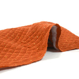 Double gaze matelassé orange confettis doré vendu au mètre