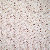 Coton imprimé ouragan floral marron fond blanc