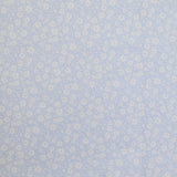 Piqué de coton imprimé fleurs printanière fond bleu clair