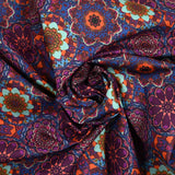 Coton imprimé kaléidoscope floral violet et bleu
