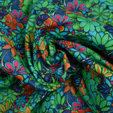 Coton imprimé rayon de soleil vert et bleu néon