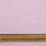 Piqué de coton imprimé étoiles fond rose clair