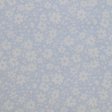 Piqué de coton imprimé fleurs printanière fond bleu clair