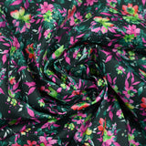 Coton imprimé fleuri graphique vert forêt et fuchsia fond noir