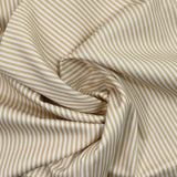Picadura de algodón imprimida a rayas de color beige