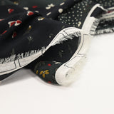 Mousseline imprimée patch fleurs et cœurs fond noir