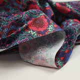 Coton imprimé kaléidoscope floral vert et fuchsia
