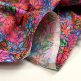 Coton imprimé rayon de soleil rose et bleu
