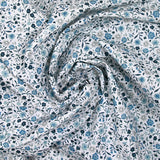 Coton imprimé ouragan floral bleu fond blanc