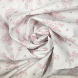 Coton imprimé petite brousse rose fond blanc