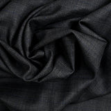 100% Prince of Wales wool tailoring fabric, black, blue, dark gray background