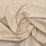 Piqué de coton imprimé étoiles fond beige